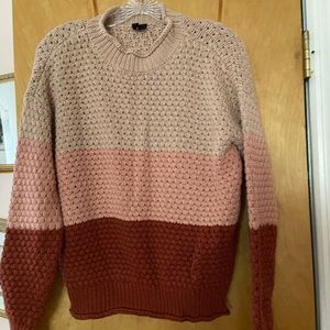 Comfy oversized cowl neck sweater in color block shades of beige, pink and rust.